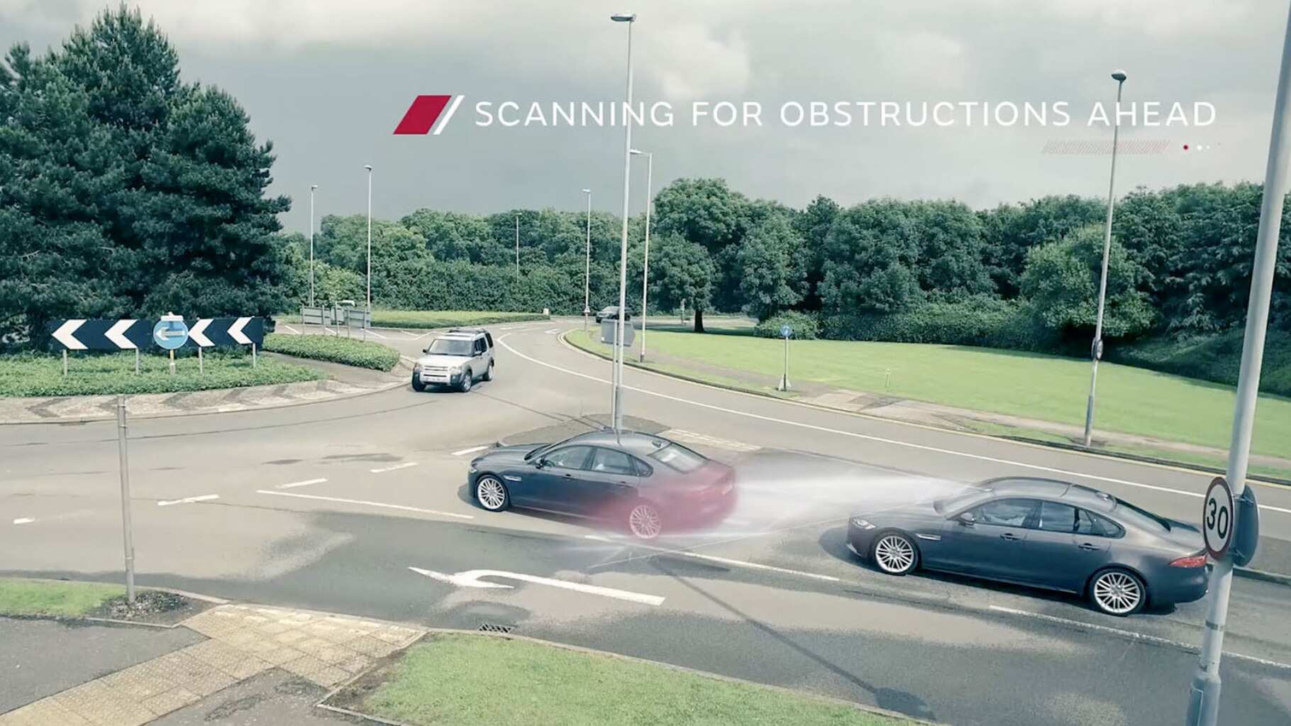 Jaguar Autonomous Vehicle On A Road Scanning For Obstacles.